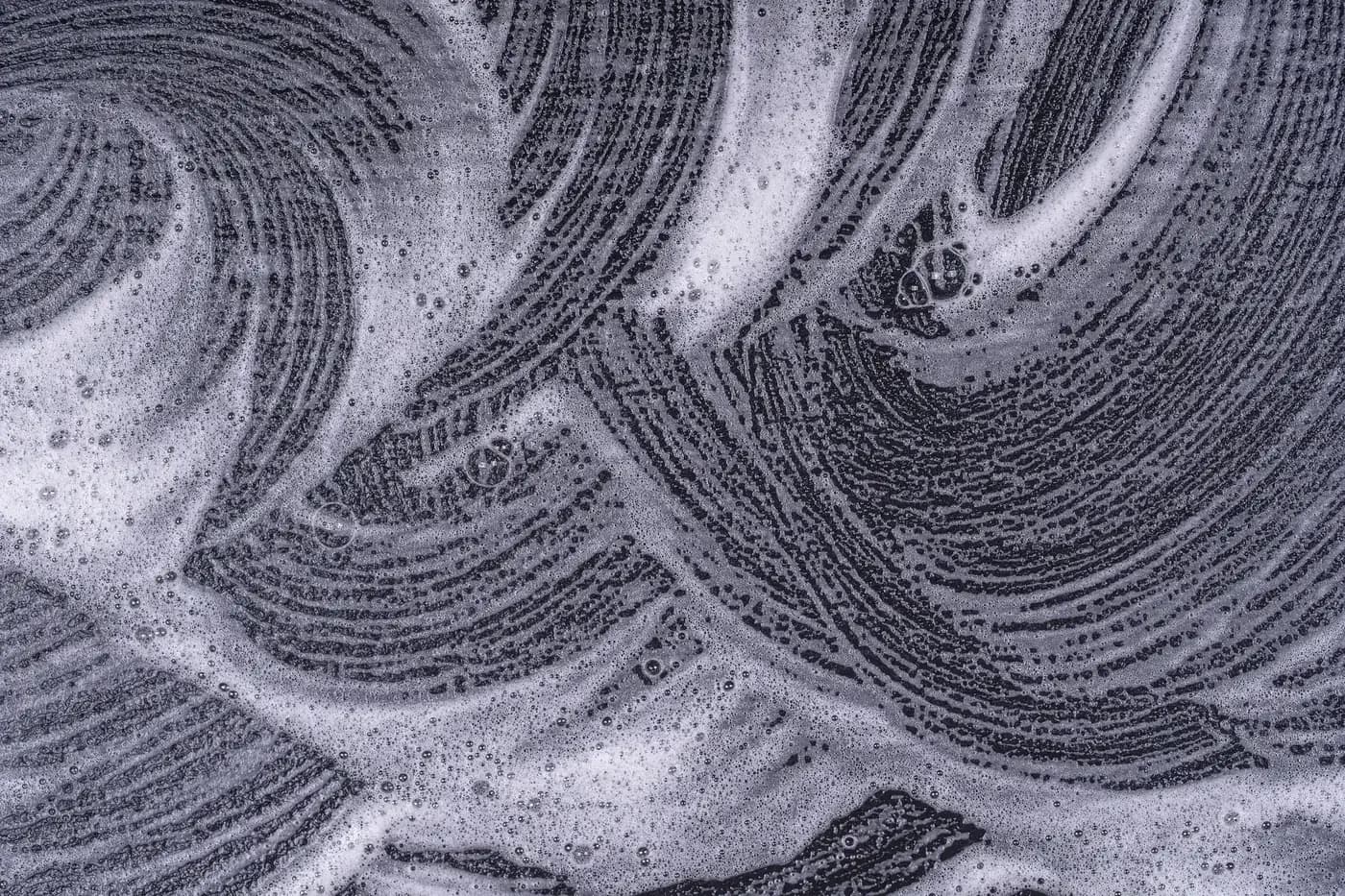 Foam texture and bubbles on a black background